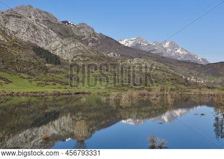 Picturesque Reservoir And Mountain Landscape In Riano. Mirror Effect. Spain