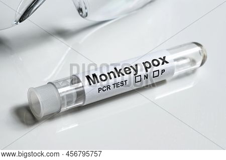 Monkeypox Pcr Test Tube On White Medical Desk Close-up. Equipment For Monkey Pox Virus Diagnostics A