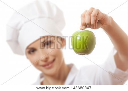 Smilende kvinde cook med apple, isoladed på hvid baggrund