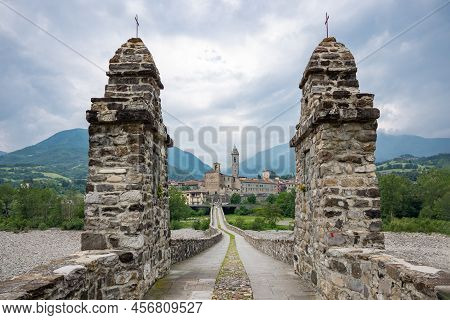 Bobbio, Italy , The Old Bridge (also Known As The Devil's Bridge) Over The Trebbia River, With The C