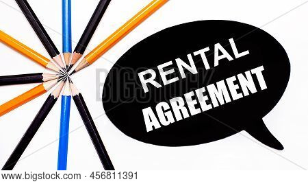 On A Light Background, Multi-colored Pencils And On A Black Background A White Card With The Text Re