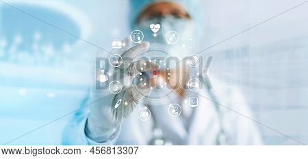 Medicine Doctor Holding A Color Capsule Pill In Hand With Icon Medical Network Connection On Modern 