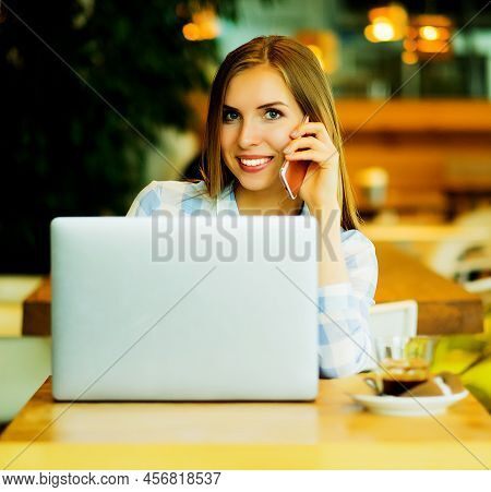 Image Of Happy Woman Using Laptop And Smartphone In Cafe. Lifest