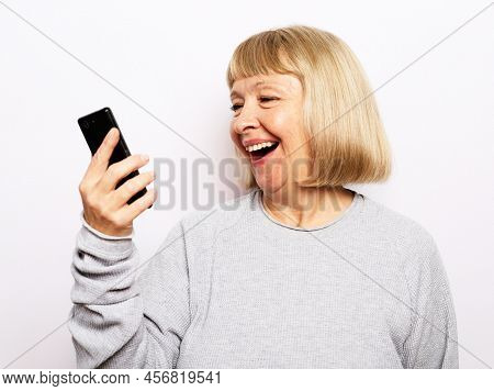 Old Woman Watching Funny Videos On Internet.