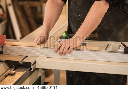 Close-up Cropped Male Carpenter Hands Working With Wood Timber, Measuring And Preparing To Cut. Wood