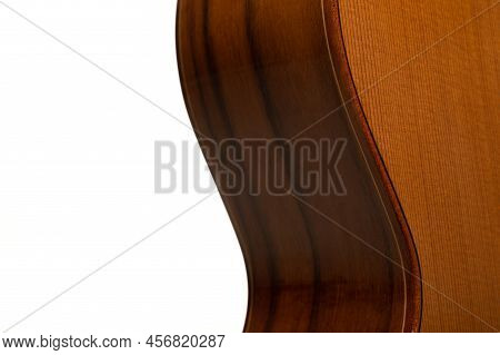 Classical guitar body up close on a pure white background