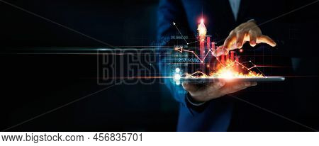 Business Growth. Businessman Holding Tablet And A Hot Of Fire Glowing Upright Arrow With Analyzing D