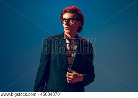 Portrait Of Stylish Young Man In Official Jasket And Black Glasses, Posing, Looking Away Isolated Ov