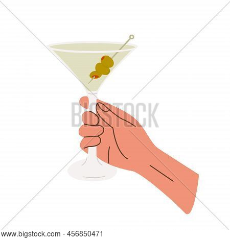 Female Or Male Hand Holding Martini Glass With Classic Cocktail Garnished With Green Olives. Glass W