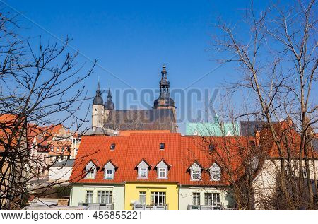 Colorful Houses In Front Of The Andreas Church In Eisleben, Germany