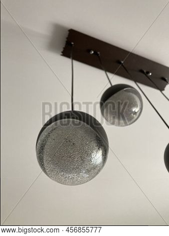 Round Plafond From Led Chandelier. The Plafond Hangs On A Long Wire. The Base Of The Chandelier On A