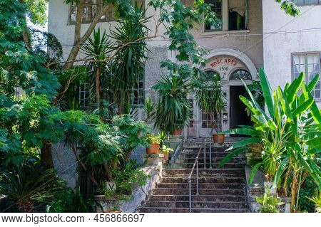 New Orleans, La - June 20: Grand Entrance To Rose Apartment Building With Front Steps And Lush Garde