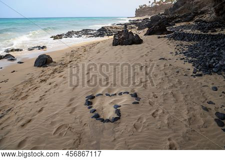 On A Beach A Heart Was Formed From Individual Stones. Stone Heart On The Beach.