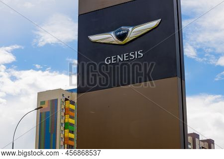 Krasnoyarsk, Russia - June 19, 2022: Genesis Brand Logo On Against Blue Sky Background. Genesis Moto