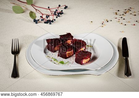 Fried Fish Rolls In Beets With Decoration
