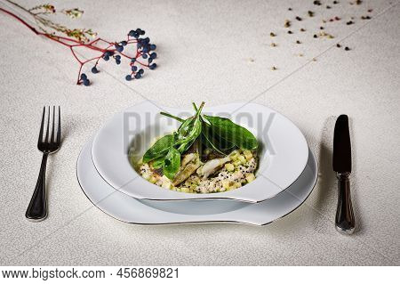 Marinated Fish Grilled And Cured With Mashed Spinach And Wheat Sprouts