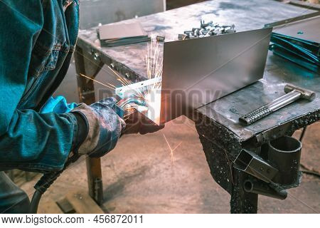 The Welder Works With Metal At The Factory