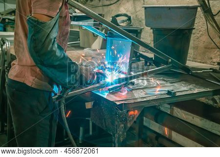 The Welder Works With Metal At The Factory