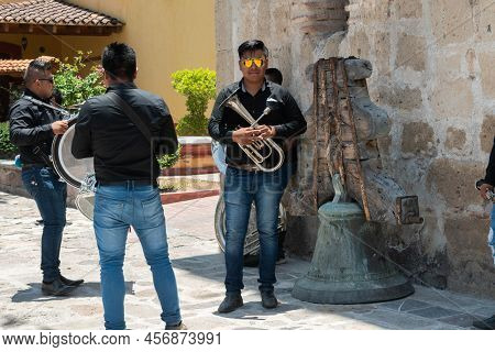 Tlacolula, Oaxaca, Mexico- May 23, 2022: Musicians Waiting Outside Of Parroquia Santa Maria De La As