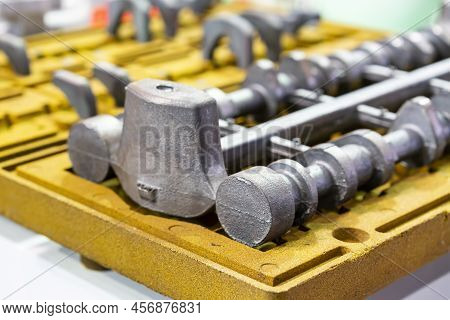 Close Up Sample Metal Casting Part Cam Shaft Automobile Product On Resin Coated Sand Shell Mold Of M