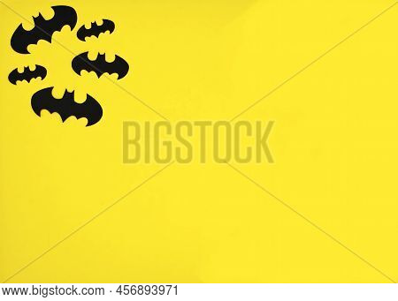 Bologna - Italy - June 22, 2022: Black Batman Logo On Yellow Background. Top View, Flat Lay.