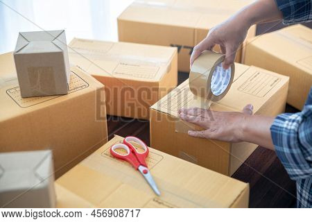 Closeup View Of Female Online Store Small Business Owner Seller Entrepreneur Packing Package Post Sh