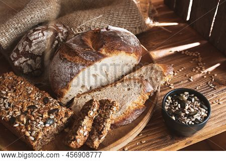 Different Kinds Of Bread With Whole Grain Products For A Healthy Nutrition Concept. Food Photography
