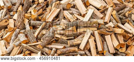 A Pile Of Stacked Firewood, Prepared For Heating The House. Firewood For Ready Heating In Winter.cho