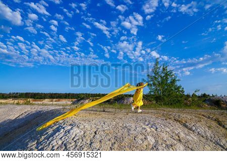 Ukrainian Patriot Girl In A Yellow Dress Against A Blue Sky. Summer Photo. Blue Sky. Sunny Day. Free