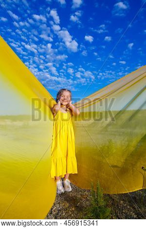 Ukrainian Patriot Girl In A Yellow Dress Against A Blue Sky. Summer Photo. Blue Sky. Sunny Day. Free