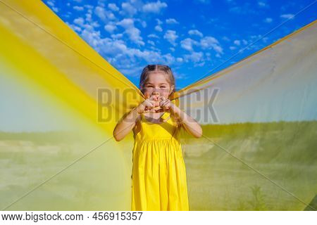 Ukrainian Patriot Girl In A Yellow Dress Against A Blue Sky. Summer Photo. Blue Sky. Sunny Day. Free