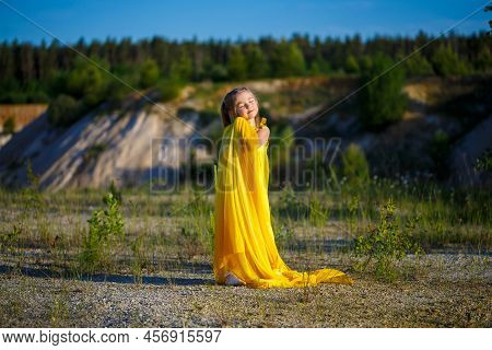 The Symbol Of Freedom Is A Ukrainian Girl Of 7 Years Old, Patriotically Dressed In A Yellow Dress Ag