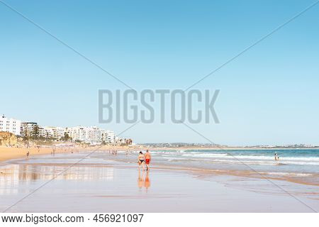 Armacao De Pera Algarve Portugal. Beautiful View On Atlantic Ocean At Day Time And City. High Qualit