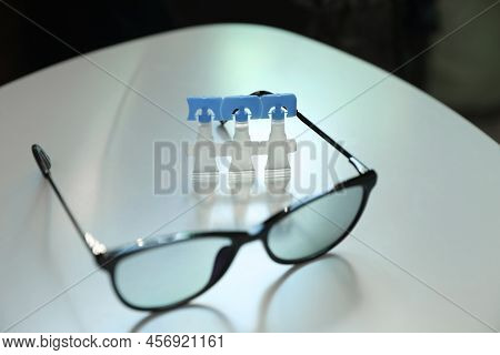 Single Dose Eye Drops And Glasses On White Table