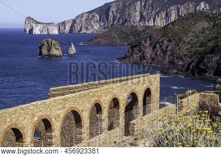 Laveria Lamarmora Abandoned Mine With Ocean Landscape In The Background In Nebida, Cala Domestica, S