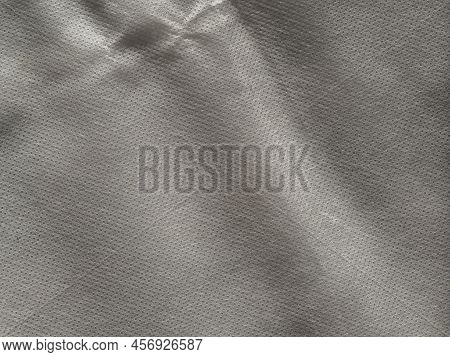 Abstract Light Gray Shadow Background.  In Soft Folds. Soft Non-woven Fabric For The Background. Lig