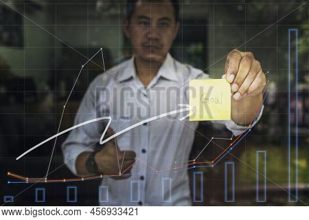 Motivation, Aim, Traget And Goal Concept. Businessman Holding Sticky Note With 