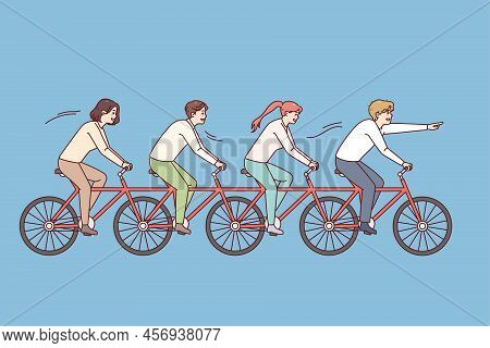 People Riding One Bike Together. Business Team On Bicycle Engaged In Teamwork. Teambuilding And Unit