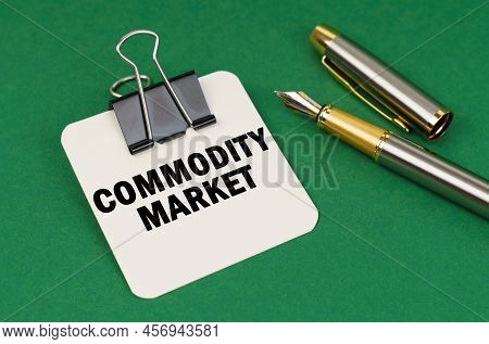 Business And Industry Concept. On A Green Surface, A Pen And A Sheet Of Paper With The Inscription -