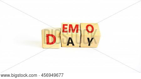 Demo Day Symbol. Concept Words Demo Day On Wooden Cubes. Beautiful White Table White Background. Bus