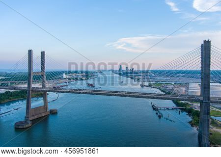 The Cochrane Bridge And The Downtown Mobile, Alabama Waterfront Skyline At Sunset In June Of 2022