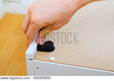 Professional Furniture Assembly Worker Assembles Shelf. Furniture Assembly Process. Diy Assembling