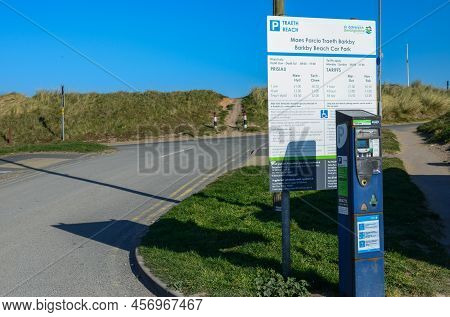 Prestatyn, Uk. Mar 27, 2022. A Bilingual Welsh And English Sign At Barkby Beach Pay And Display Car 