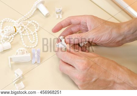Male Hands Are Assembling Roller Blinds, Close-up. Assembly Of Roller Blinds