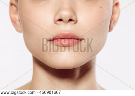 Closeup Female Lips, Cheeks And Nose Isolated Over White Studio Background. Concept Of Cosmetology, 