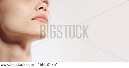 Flyer. Closeup Female Lips, Cheeks And Nose Isolated Over White Studio Background. Concept Of Cosmet