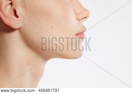 Flyer. Closeup Female Lips, Cheeks And Nose Isolated Over White Studio Background. Concept Of Cosmet