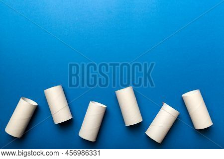 Flat Lay Composition With Empty Toilet Paper Rolls And Space For Text On Color Background. Recyclabl
