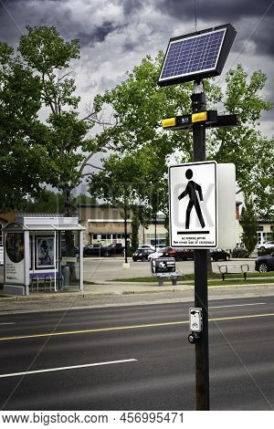 Airdrie Alberta Canada, June 12 2022: A Solar Powered Pedestrian Crossing Sign With Led Warning Ligh