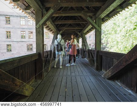Henkersteg Wooden Bridge Over River Pegnitz In Nuernberg